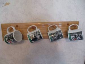 lot 205 image: Minnesota Hockey Mugs on Wall Hange...