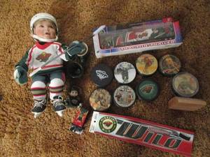lot 521 image: Lot of MN Wild Memorabilia -Pucks, ...