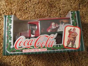lot 528 image: Coca Cola Die Cast Metal Bank in or...