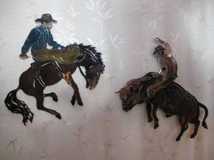 lot 557 image: 2 Metal Cowboys Wall Dcor- each 2...