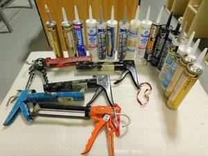 lot 102 image: Caulk and Caulking Guns