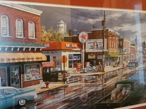lot 13 image: Reflections Of Main Street Framed Print By Ken Zylla