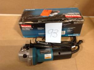 lot 93 image: Makita 7.5 Amp 4-12 in. Paddle Switch Angle Grinder in good condition