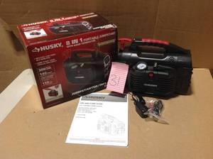 lot 31 image: Husky 8-in-1 12-Volt Power SourceJumpstarter in good condition