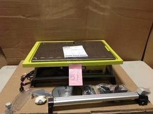 lot 51 image: RYOBI 7 in. 4.8 Amp Tabletop Tile Saw in good condition