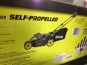 lot 104 image: RYOBI 20 in. 40-Volt Brushless Lithium-Ion Cordless Battery Self Propelled Lawn Mower with 5.0 Ah Battery and Charger Included in good conditions