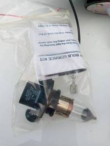 lot 32 image: Snow plow headlight housing and light bulb
