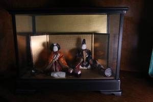 Japanese figures in glass enclosure...
