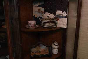Shelf full of Japanese china and collectibles