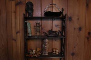 Wall display with Asian art and home dcor