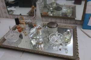 Perfume on a mirrored tray...