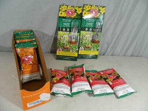 lot 91 image: 2 New Hanging Basket Hummingbird Feeders and 9 Bags of Powder Feed