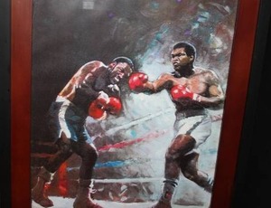 lot 78 image: Muhammad Ali and Joe Frazier Ylli Harun Framed & Matted Print