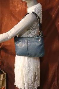 lot 83 image: Coach Vintage Teal Small Hobo Baguette Leather Purse