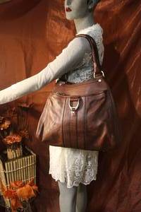 lot 73 image: Cole Haan Brown Leather Bucket Bag