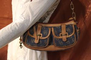 lot 77 image: Dooney & Bourke Signature Denim Small Banana Bag