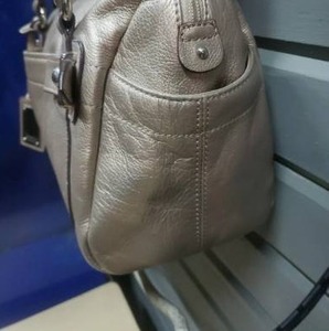 lot 41 image: Tignanello Metallic Nickel Champagne Gold Leather Convertible Crossbody Purse