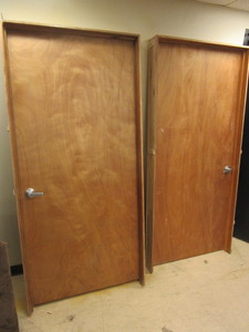 lot 536 image: WOOD DOORS, IN CASINGS, WITH BRUSHED CHROME HANDLES