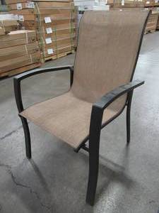 lot 210 image: Tan Sling Back Arm Chair.