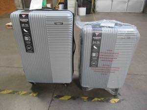 lot 707 image: Travelers Club Basette 2-Pc. Hardside Luggage Set in Gray - Dent on large caseslight scratches.