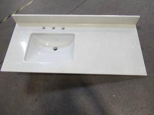 lot 354 image: Vanity Top 49 x 22 x 3 12 White Marble, 8 Faucet Spread With Single Square Basin With Overflow.