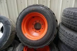 lot 13 image: Set of 4  - Bobcat Brand Skid Loader Tires and Rims