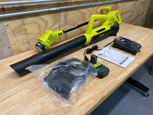 lot 104 image: RYOBI Lot of 2 Tools.   An 18-Volt ONE Lithium-Ion Cordless String Trimmer and a ONE 90 MPH 200 CFM 18-Volt Lithium-Ion Cordless Battery Leaf BlowerSweeper.  Includes 1 battery and 1 charger.
