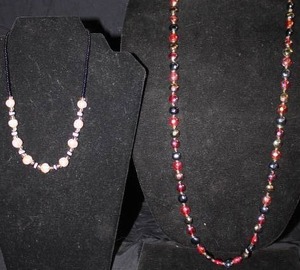 Excellent Cherry AmberBlack and Carved Bead Necklaces