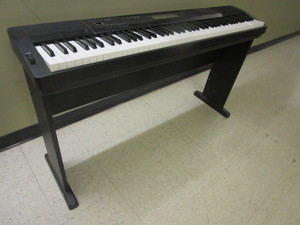 lot 719 image: CASIO ELECTRIC KEYBOARD