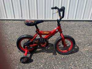 lot 58 image: Huffy Red Bicycle 12 Wheels