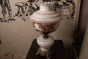 lot 102 image: Vintage floral hurricane lamp measuring 19 tall. Works great.