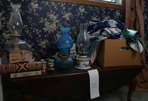 lot 20 image: Lot including drop leaf coffee table, three hurricane lamps, handag, glassware, kimonos