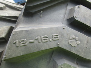 lot 7 image: (4) New Bobcat Tires & Slightly Used Rims