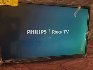 lot 27 image: Philips 32 Roku Led TV with legs and remote
