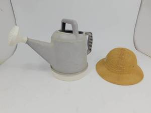 lot 64 image: Watering Can  Brookstone Hat