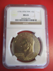 NGC Certified 1776-1976 Type 1 Eisenhower Dollar in Mint State 65 Condition. Distinctive Moon and Bell Bicentennial Reverse Markings. NGC Certification Number 2662665-001