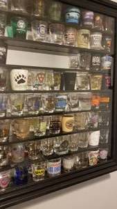lot 59 image: Display Case and Collection of Over 65 Shot Glasses