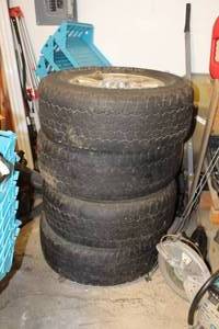 lot 86 image: Lot of (4) Goodyear Wrangler LT27565R18 Light Truck Tires with GMC 18in. 8-Lug Wheels