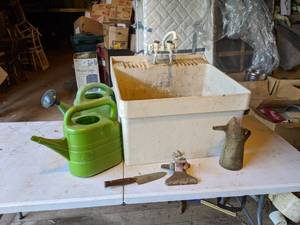 lot 214 image: Utility Sink, Watering Cans, Sprinkler, and More