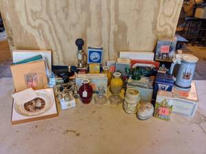 lot 169 image: Lot of AVON Collectible Decanters, Plates, Mugs, and More