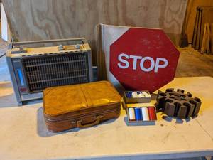 lot 73 image: Quartz Heater, Vinyl Double-Sided Stop Sign, Poker Chips and Small Suitcase