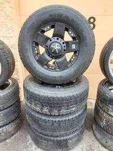 lot 1 image: 4-17 Rock Star Wheels Universal 5-135 Lug Pattern With A Set Of Good Year Wrangler 2657017 Tires With Caps. Good Rubber.