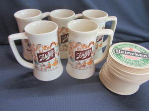 lot 137 image: Schlitz Mugs, Heineken Coasters