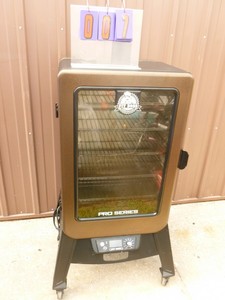 lot 7 image: Pit Boss smoker. Used condition. Ignitor seems to be intermittent. Can be lit manually. As shown.