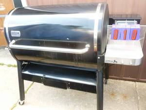 lot 10 image: Weber pellet grill for parts or repair. Used condition. Would not power up. As shown.
