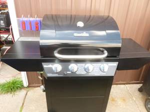 lot 15 image: Charbroil 4 burner gas bbq grill. Appears to have been used once. As shown.