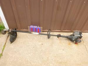 lot 19 image: Craftsman 2 cycle weed trimmer. Used condition. Tested & works. As shown.
