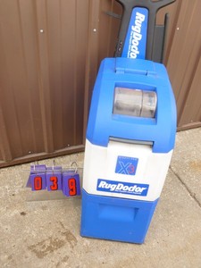 lot 39 image: Rug Doctor Carpet Cleaner. Powers up & sprays. As shown.
