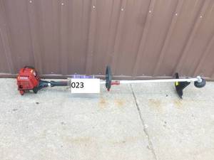 lot 23 image: Craftsman 4 cycle weed trimmer. Looks new. Tested & works. As shown.