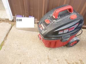 lot 38 image: Craftsman 4 gallon vaccuum. Powers up. No hose or accessories included. As shown.